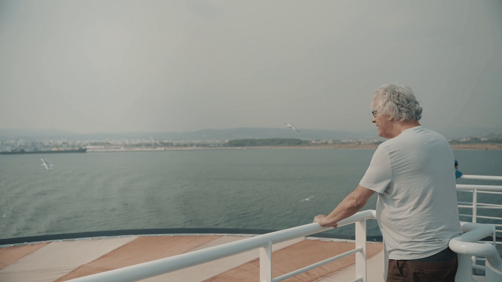 vlcsnap-2024-04-28-01h35m41s879 A man at the stern of a ship gazing at the sea. Film still from the documentary "A couple of years".